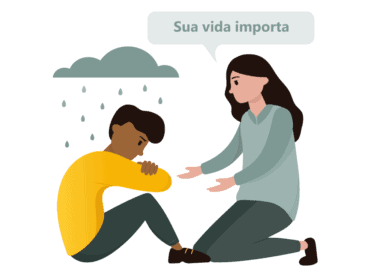 Ilustração de um homem sentado ao chão, com semblante triste. À sua frente tem uma mulher oferecendo sua mão como ajuda e um balão onde se lê a frase: “sua vida importa”.